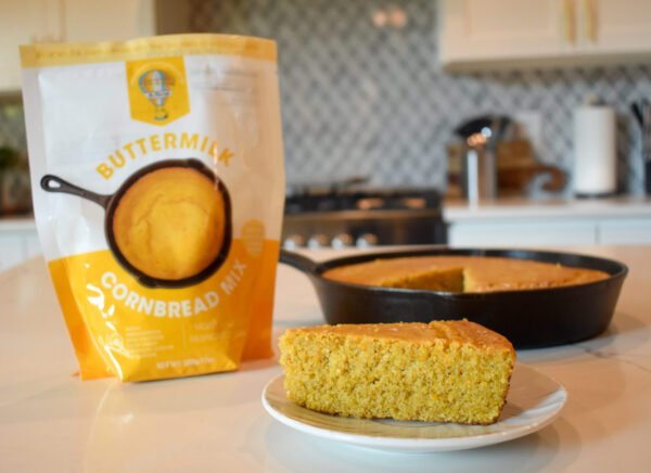 Fluffy buttermilk cornbread displayed next to Be Free Cafe's Cornbread Mix.